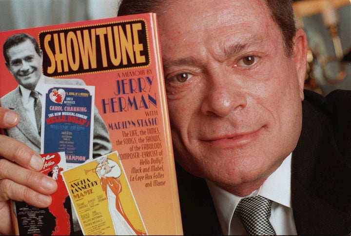 Composer Jerry Herman, seen in this 1996 file photo, displays his book "Showtune."&nbsp;