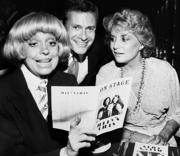 In this 1981 file photo, Carole Channing, left, and TV personality Barbara Walters look over the program with Herman at a Bro