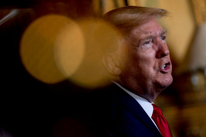 President Donald Trump speaks to members of the media following a Christmas Eve video teleconference with members of the military at his Mar-a-Lago estate in Palm Beach, Fla., Tuesday, Dec. 24, 2019. (AP Photo/Andrew Harnik)