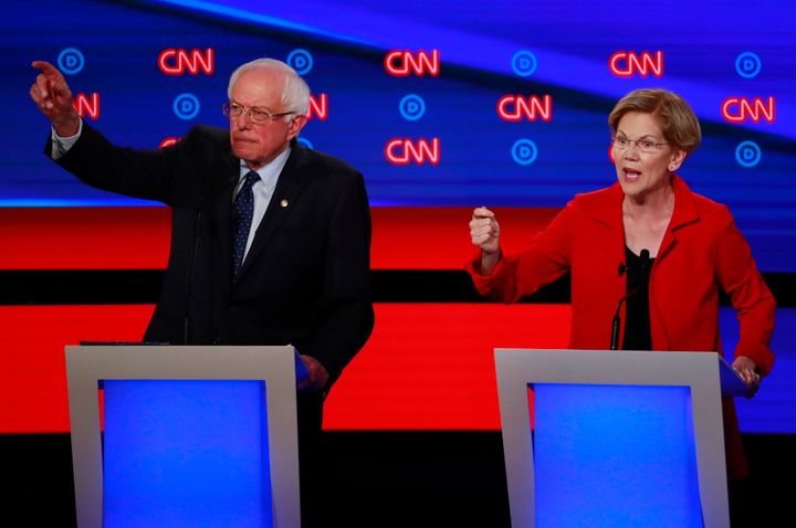 Bernie Sanders, left, and Elizabeth Warren have argued for Medicare for All on the debate stage. But the health care industry is outspending them on the airwaves.