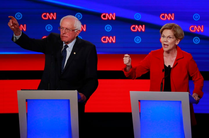 Bernie Sanders, left, and Elizabeth Warren have argued for Medicare for All on the debate stage. But the health care industry is outspending them on the airwaves.