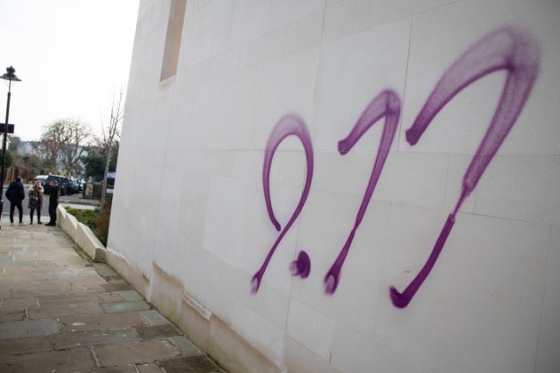 Anti-semitic graffiti in the form of a 9/11 sprayed onto the outside of the South Hampstead Synagogue in North London.