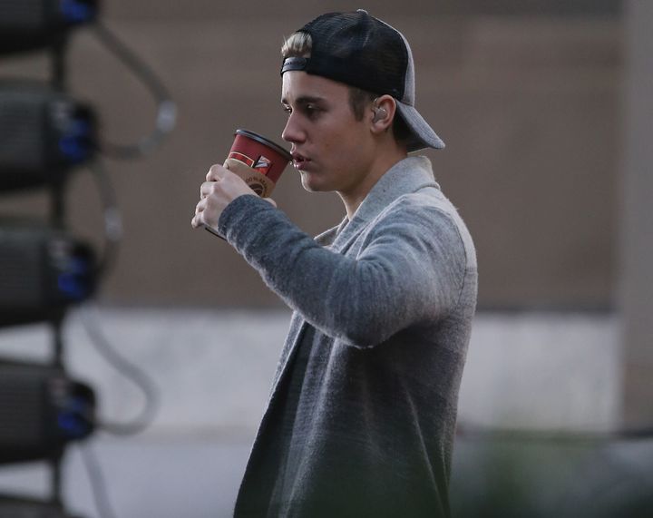 It isn't clear what brand of coffee Justin Bieber is drinking in this photo, but we hope for his sake it has an acceptable lid.