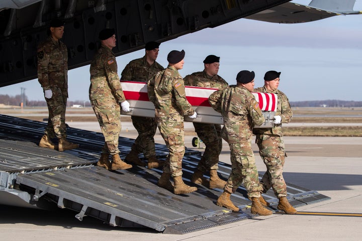 Dec. 25, 2019 - An Army carry team moves a transfer case containing the remains of U.S. Army Sgt. 1st Class Michael Goble, at Dover Air Force Base, Del.. Goble, a U.S. Special Forces soldier who died in Afghanistan this week, was seizing a Taliban weapons cache when he was killed, the U.S. military said Friday. (AP Photo/Alex Brandon, File)