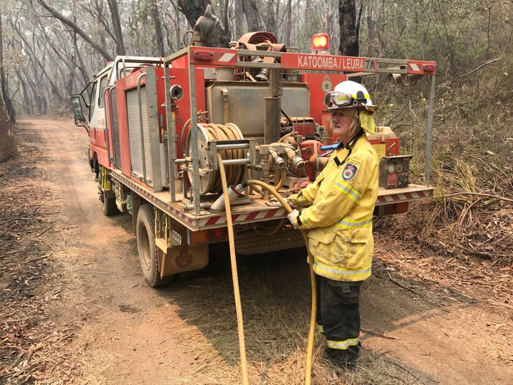 A volunteer from the New South Wales Rural Fire Service works to extinguish spot fires following back burning operations in Mount Hay, in Australiaâs Blue Mountains, December 28, 2019. Picture taken December 28, 2019. REUTERS/Jill Gralow