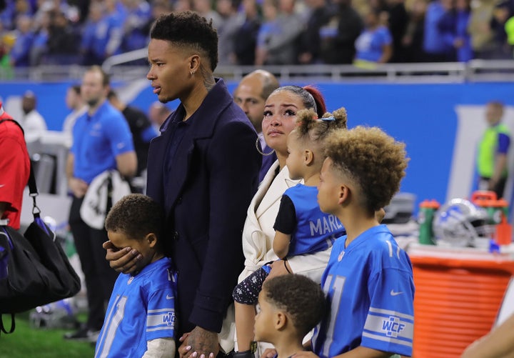 Marvin Jones and his family stand on the sideline in a moment of silence for his infant son, Marlo.