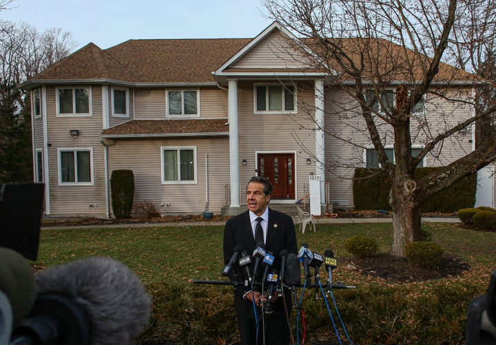 New York Governor Andrew Cuomo speaks to the media outside the home of rabbi Chaim Rottenbergin Monsey, in New York on Decemb