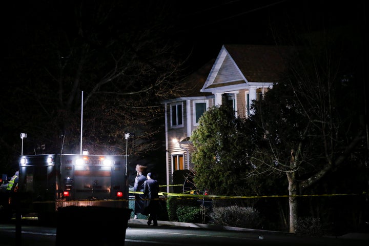 People walk in front of a house where 5 people were stabbed at a Hasidic rabbi's home in Monsey, New York, U.S., December 29. 2019. 