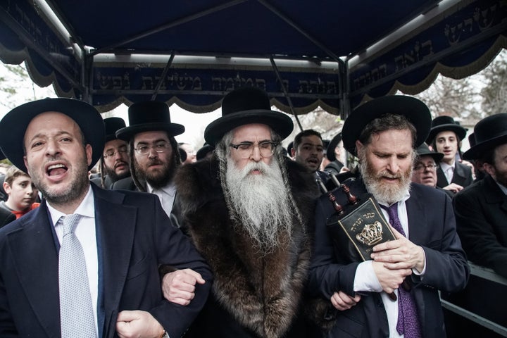 Rabbi Chaim Rottenberg (center) and others celebrate the arrival of a new Torah scroll in Monsey, New York, on Dec. 29, 2019.