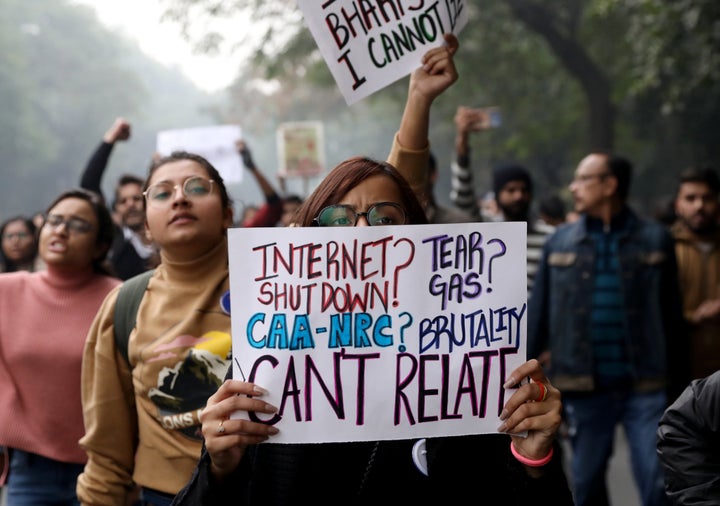 Demonstrator display placards and shout slogans during a protest against a new citizenship law, in New Delhi, India, December 19, 2019. REUTERS/Anushree Fadnavis