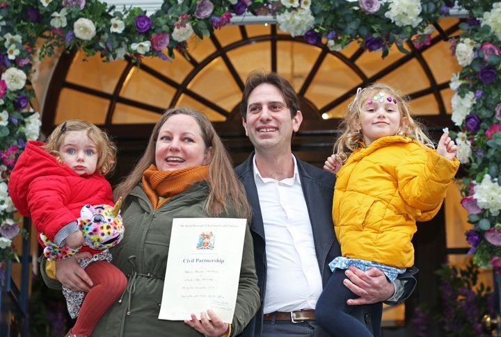 Rebecca Steinfeld and Charles Keidan, with their children Ariel and Eden, outside Kensington and Chelsea Register Office in King's Rd, Chelsea, London, after becoming one of the first couples to register for a civil partnership.