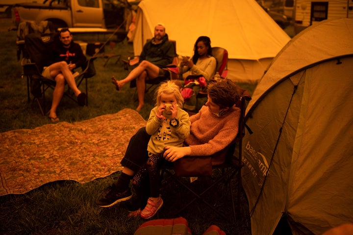 Evacuees at the showgrounds in the southern New South Wales town of Bega sit and wait on Dec. 31, 2019.