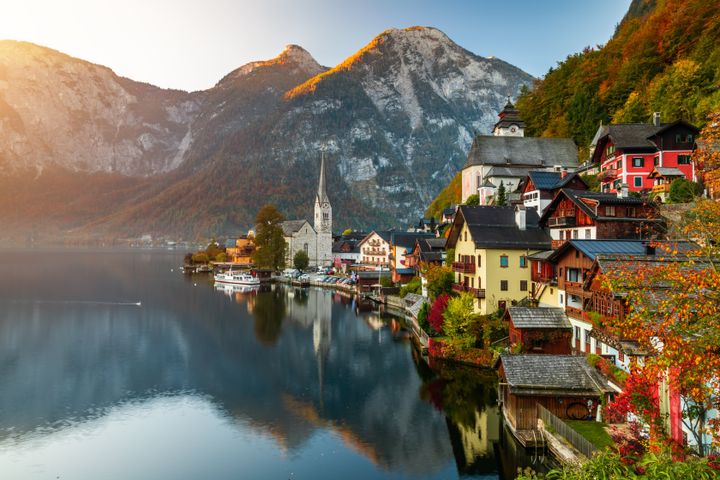 Scenic view of famous Hallstatt mountain village with Hallstatter lake. Autumn sunrise on Hallstatt lake. Location: resort village Hallstatt, Salzkammergut region, Austria, Alps. Europe.