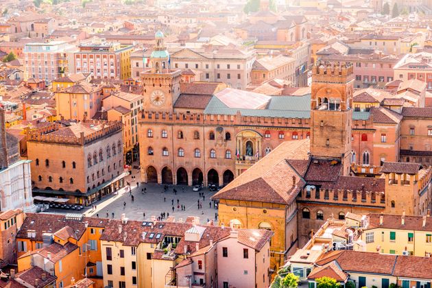 Aerial cityscape view from the tower on Bologna old town center with Maggiore square in Italy