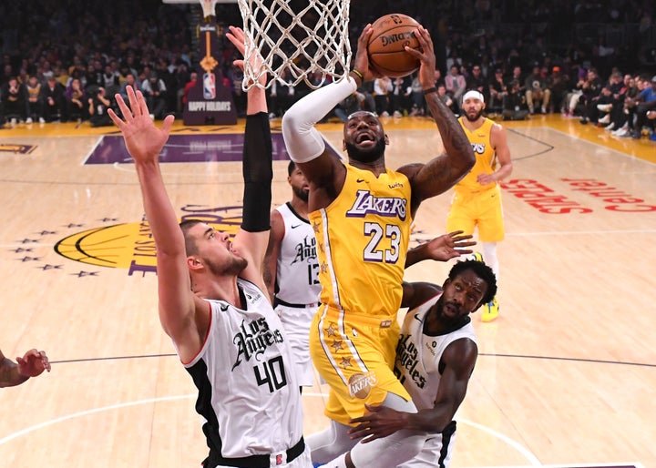 LeBron James goes for a basket in the first half of the game against the Los Angeles Clippers at the Staples Center on December 25, 2019.