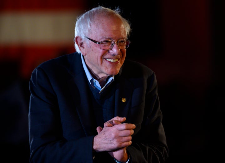 Sen. Bernie Sanders (I-Vt.) leaves the stage after speaking at a New Year's Eve campaign event in Des Moines, Iowa. His fundraising numbers give him reason to smile. qhiukiuiqkeinv