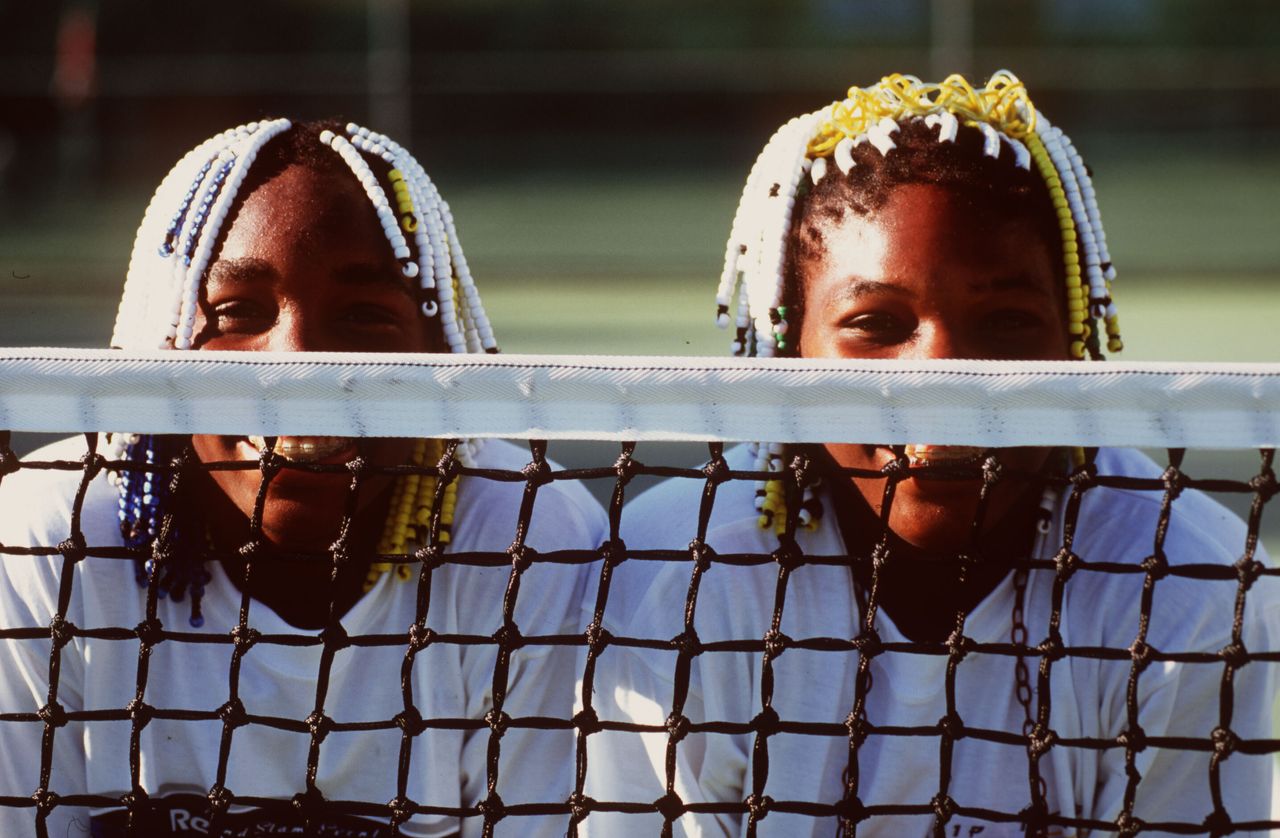 Teenagers Venus (left) and Serena Williams pose together during the Adidas International event in Sydney, Australia, on Jan. 16, 1998.