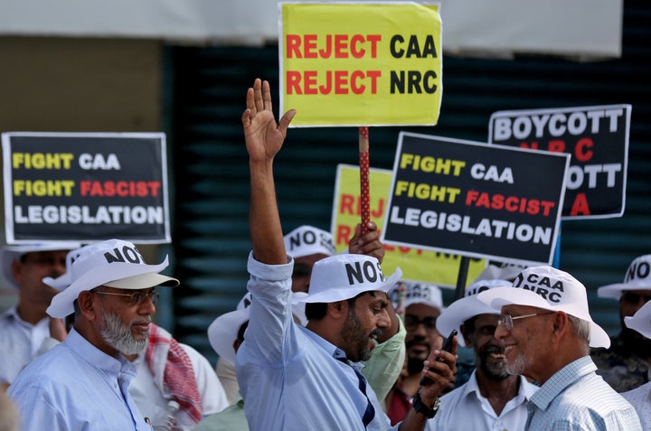 Demonstrators gather to attend the protest rally.