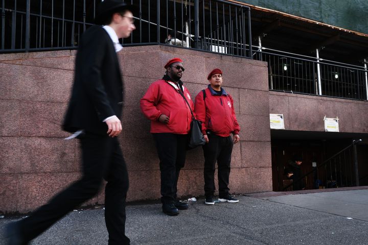 Members of the unarmed crime prevention organization, the Guardian Angels, patrol in Crown Heights, Brooklyn, on New Year's Eve in New York City.
