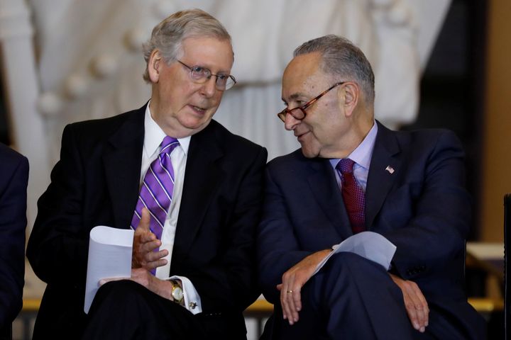Senate Majority Leader Mitch McConnell and Senate Minority Leader Chuck Schumer talk during a ceremony in October 2017. 