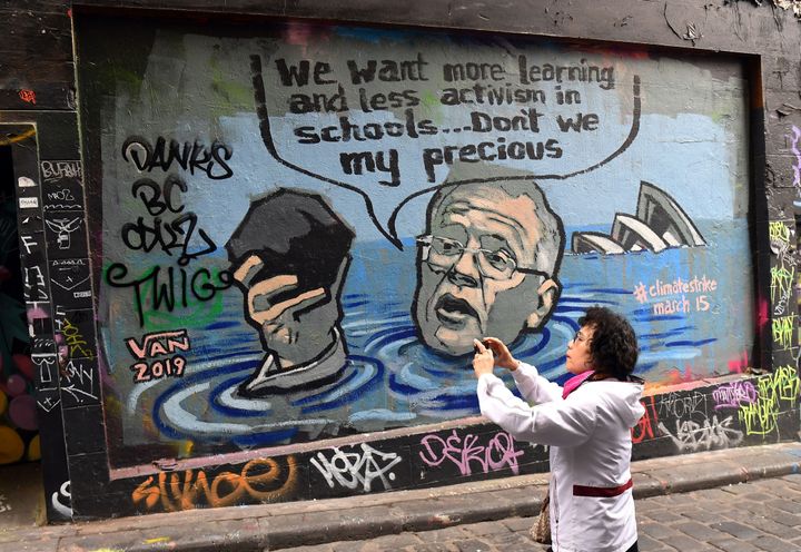 A mural showing Scott Morrison holding a lump of coal as it advertises a rally by students around the world to protest against climate change.