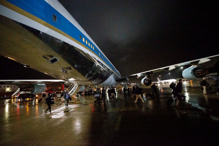 White House staff, Secret Service agents and reporters swap planes to a waiting Air Force One on Nov. 29, 2019, at Ramstein Air Base, Germany.