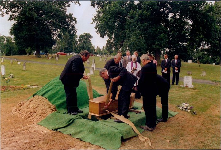 The coffin carrying the Bolney Torso is lowered into its unmarked grave in 1994 