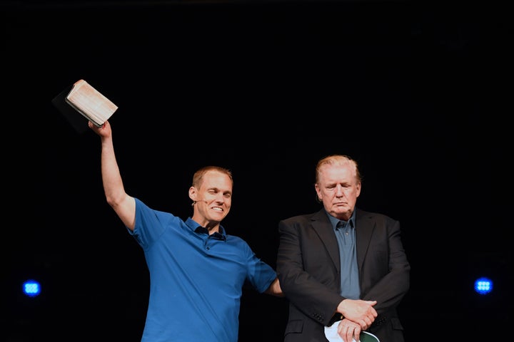 President Donald Trump prays next to Pastor David Platt as he visits McLean Bible Church in Vienna, Virginia on June 2, 2019.