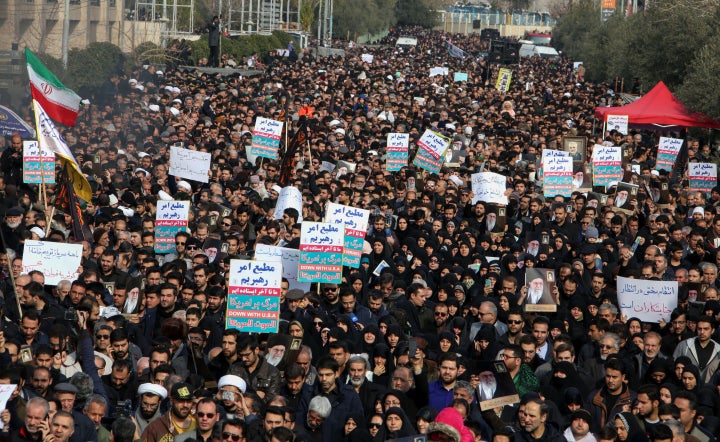 Iranians hold anti-U.S. banners during a demonstration in the capital Tehran on Jan. 3, following the killing of Iranian Revo