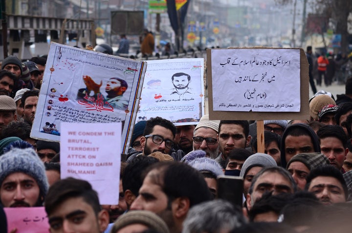 Shiite muslims shout anti-U.S. slogans as they protest in central Kashmir.