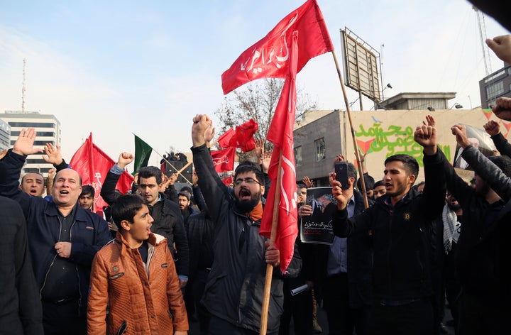 People gather to protest against Soleimani's assassination after Friday prayers in Tehran.