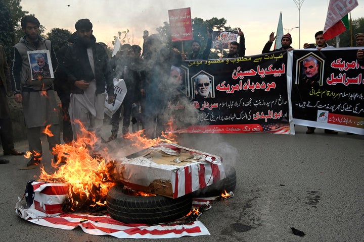 Demonstrators burn U.S. flags in Islamabad.