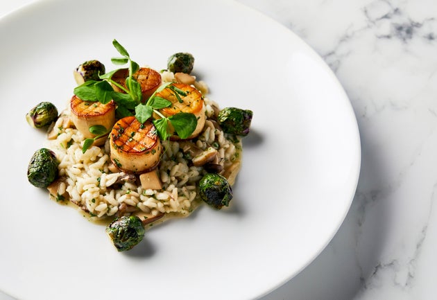 The mushroom scallops and wild mushroom risotto slated to be served as the main course for the all-vegan...