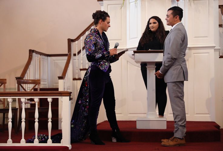 United Methodist Church minister Rev. Jordan Harris (right) and his partner Nathaniel Devarie are married at the Old West Church in Boston on Oct. 12, 2019. 