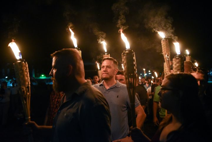White nationalists march on the grounds of the University of Virginia ahead of the Unite the Right Rally in Charlottesville, Virginia, in August 2017. Many of the white supremacists in attendance chanted "blood and soil."