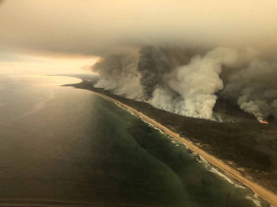 Thick plumes of smoke rise from bushfires at the coast of East Gippsland, Victoria, Australia, January 4, 2020 in this aerial picture taken from AMSA Challenger jet. 