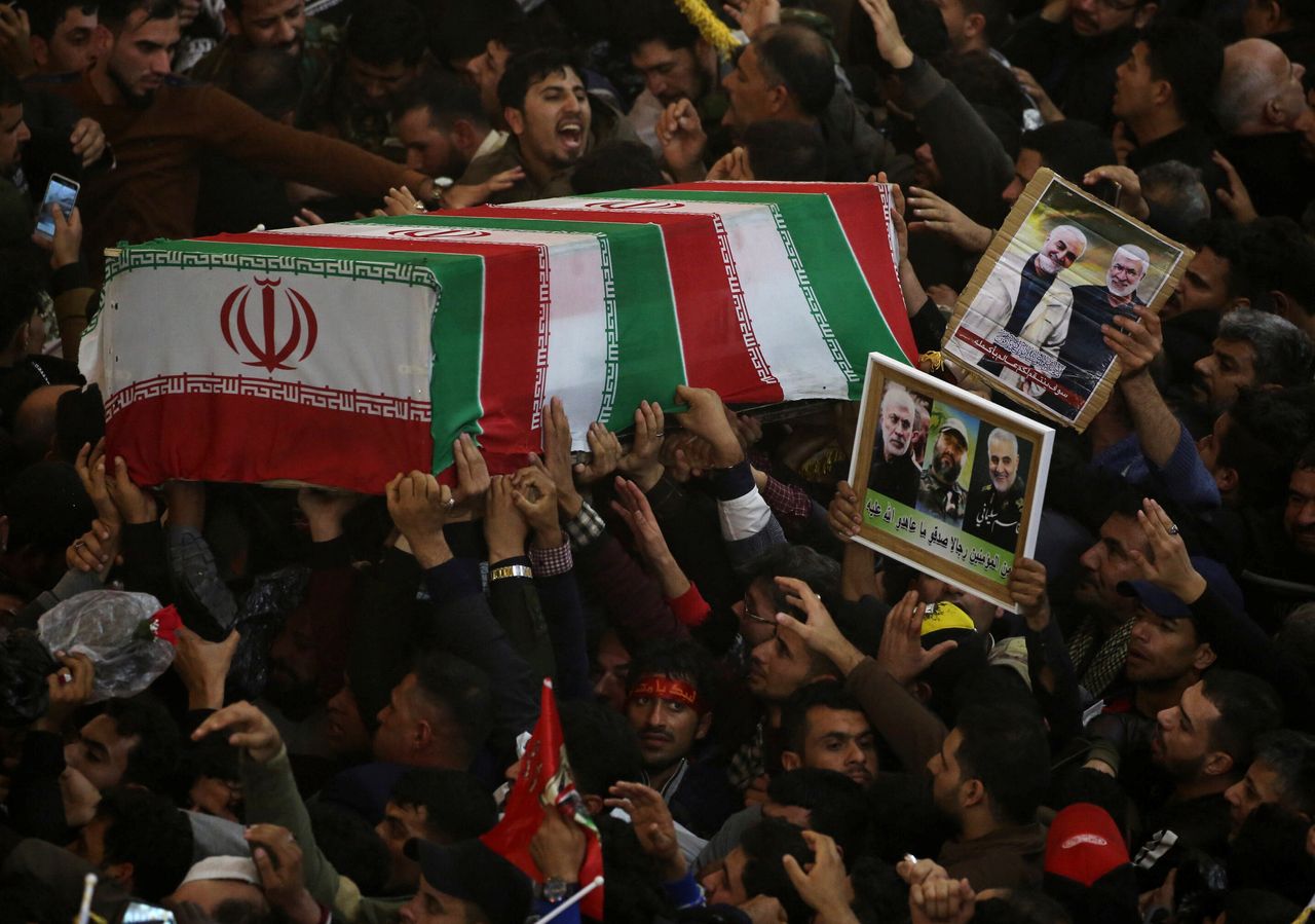 Mourners attend the funeral procession of Qassem Soleimani.