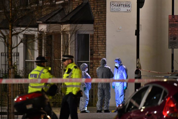 Forensic officers at the crime scene after Metropolitan police cordon off Charteris Road close to the junction with Lennox Road in Finsbury Park after a man was stabbed to death in north London on Friday evening.