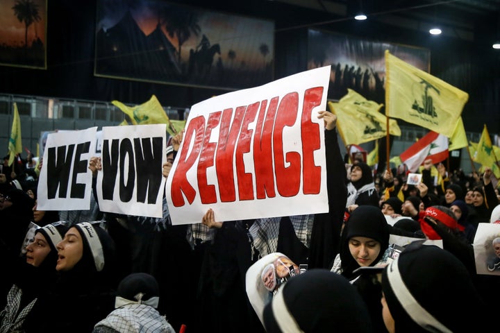 Supporters of Lebanon's Iran-allied Hezbollah movement on Sunday hold banners vowing for revenge for the death of Iranian Gen. Qassem Soleimani and Abu Mahdi al-Muhandis, the deputy head of the Popular Mobilization Forces.