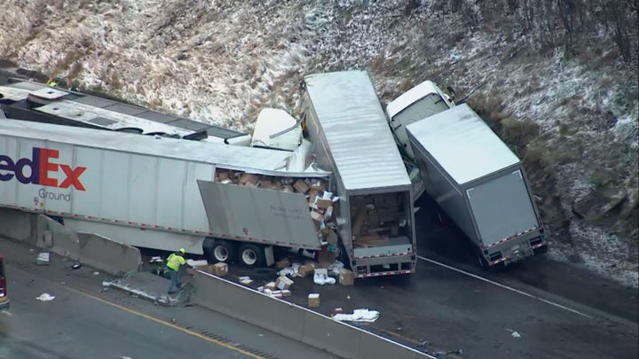 At least five people were killed and dozens were injured in the crash early Sunday that involved multiple vehicles, a transpo