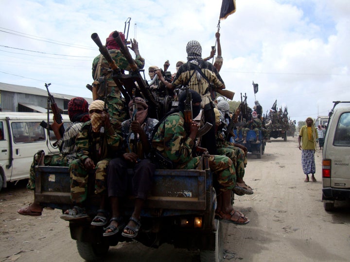 Al-Shabaab fighters display weapons as they conduct military exercises in northern Mogadishu, Somalia, in 2010.