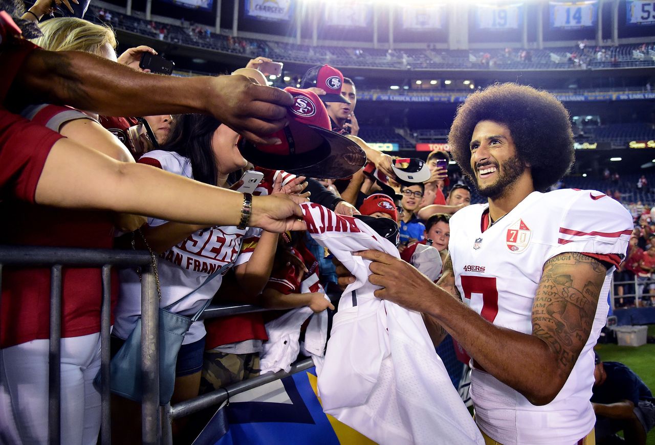 San Francisco 49ers quarterback Colin Kaepernick signs autographs for fans after a 31-21 win over the San Diego Chargers on Sept. 1, 2016.