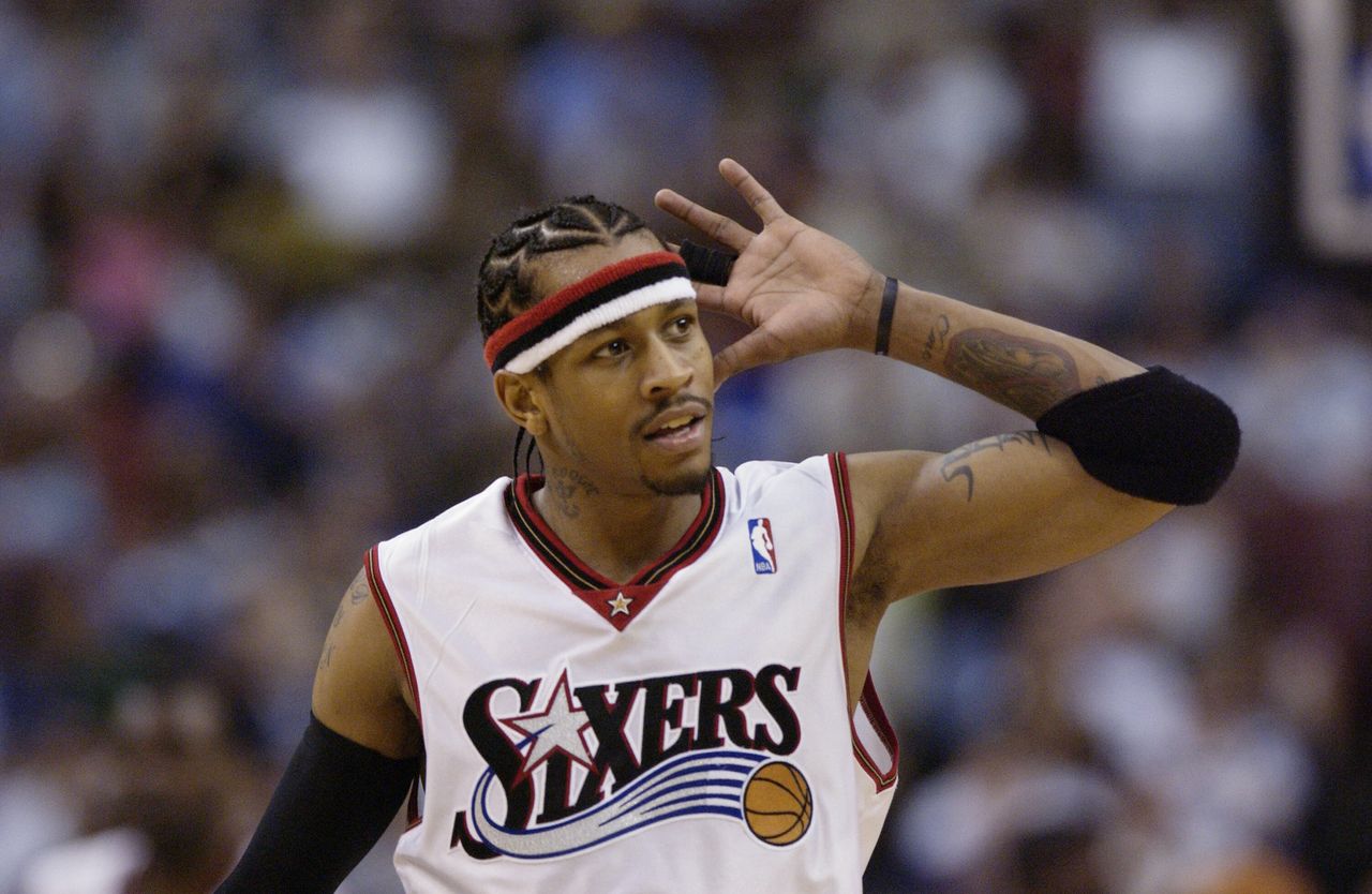 Allen Iverson of the Philadelphia 76ers gestures to hear cheers from the crowd during a game against the Washington Wizards on March 30, 2003.
