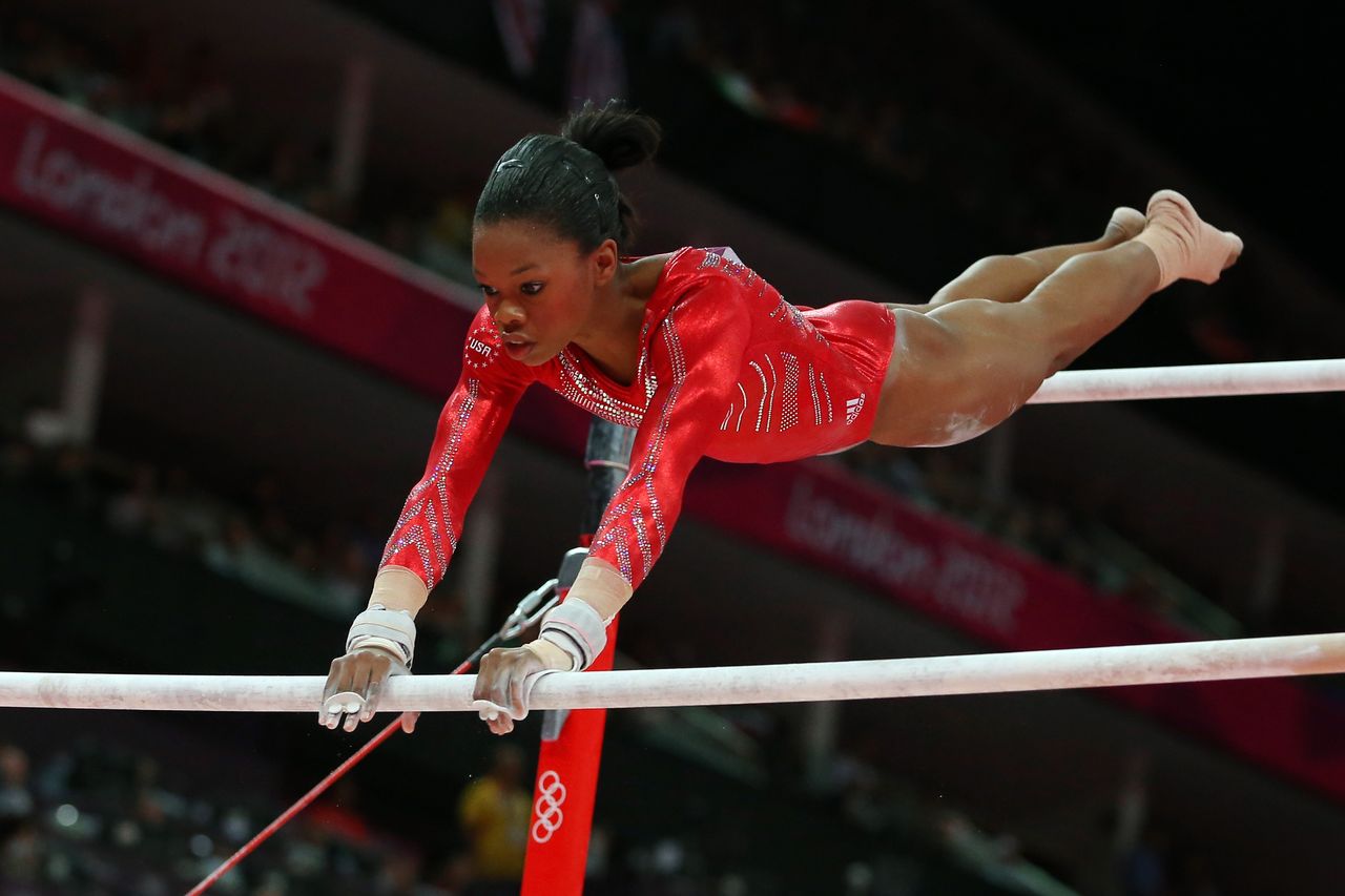 Gabby Douglas competes on the uneven bars in the artistic gymnastics women's team final at the London Olympics on July 31, 2012. 