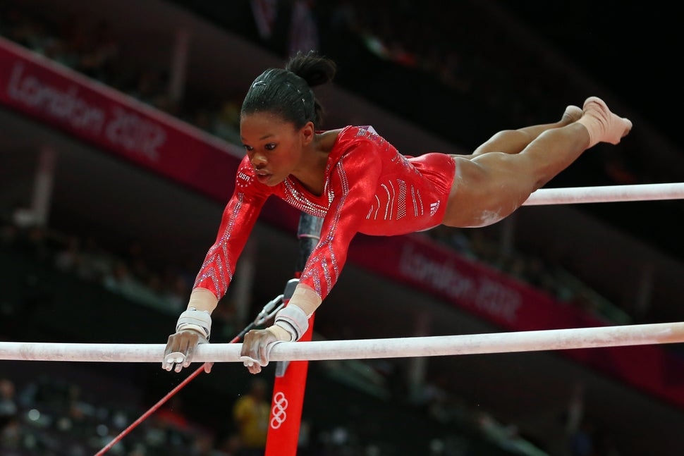 Gabby Douglas competes on the uneven bars in the artistic gymnastics women's team final at the London Olympics on July 31, 20