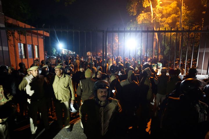Police gather outside a gate of the Jawaharlal Nehru University (JNU) following violence on January 5, 2020.