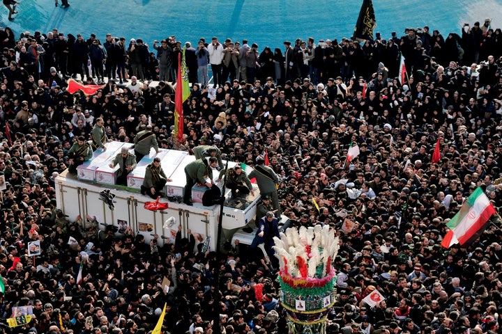 Coffins of Gen. Qassem Soleimani and others who were killed in Iraq by a U.S. drone strike, are carried on a truck surrounded by mourners during a funeral procession at the Enqelab-e-Eslami (Islamic Revolution) square in Tehran on Jan. 6, 2020.