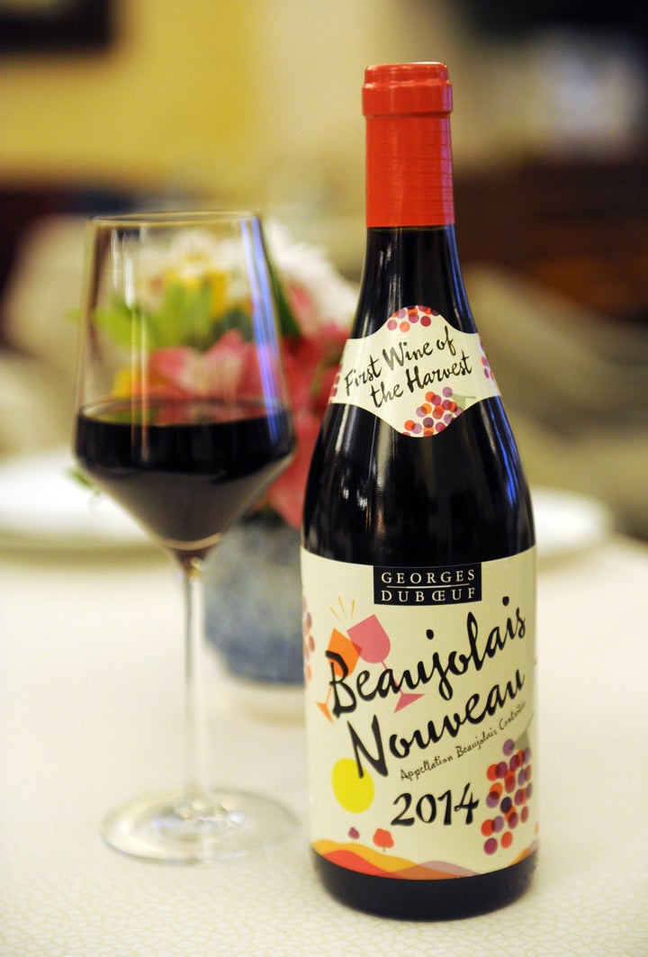 IMAGE DISTRIBUTED FOR LES VINS GEORGES DUBOEUF - The 2014 Georges Duboeuf Beaujolais Nouveau arrives in the U.S., Wednesday, Nov. 19, 2014, in New York. According to French law, the wine is released on the third Thursday of each November. (Photo by Diane Bondareff/Invision for Les Vins Georges Duboeuf/AP Images)