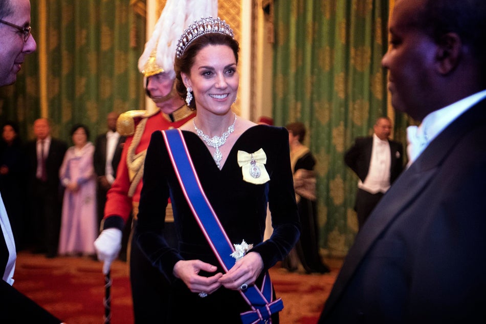In a long velvet gown by Alexander McQueen for a reception at Buckingham Palace.
