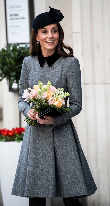 Wearing her old favourite, Catherine Walker, with a John Lock hat.